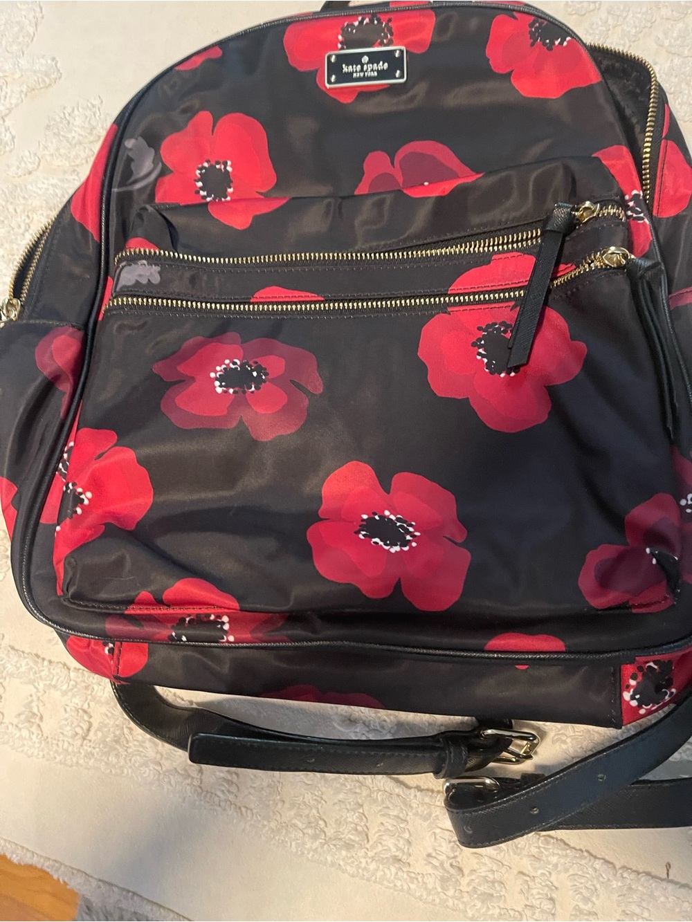 kate spade black backpack with red floral pattern